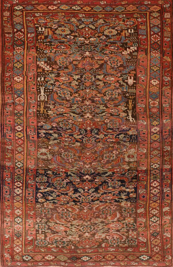 Dark brown rug with intricate geometric and stylized patterns, featuring multiple borders in shades of red and rust.