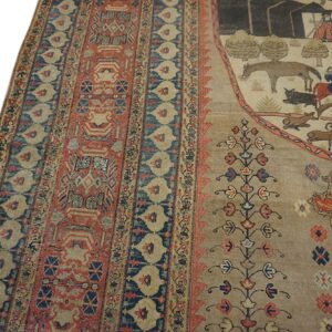 Pictorial tan rug featuring scenes of animals and people bordered by complex red and blue geometric patterns.