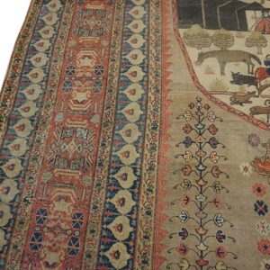 Pictorial rug featuring pastoral figures and animals bordered by geometric patterns in rust, navy, and beige.