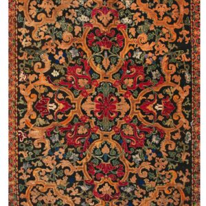 Highly detailed rug featuring gold, red, and green symmetrical floral and vine patterns on a black field.