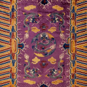 High-pile purple rug featuring five blue dragons and a multi-colored border of geometric waves.