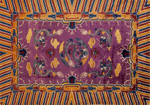 Violet rug with blue and white dragons, framed by an intricate, multi-hued border of orange, blue, and maroon stripes.