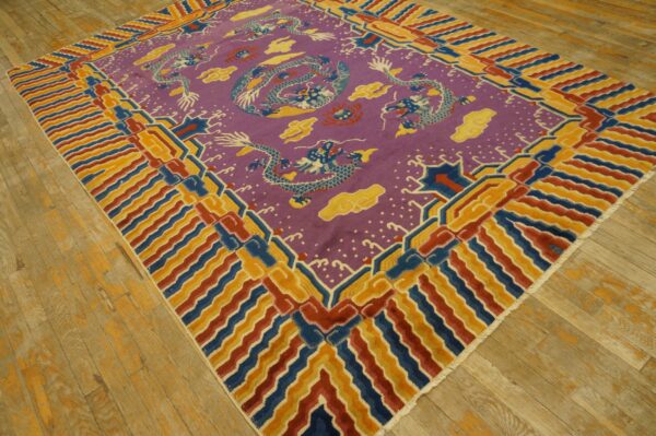 Purple rug with blue dragons and yellow clouds, bordered by colorful red, blue, and gold stripes on wood planks.