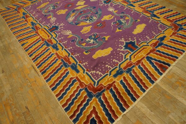 Purple rug with blue dragons and yellow clouds, bordered by geometric red, blue, and gold stripes on wood flooring.