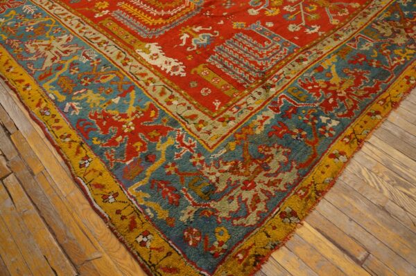 Close-up of a high-pile rug showing red, teal, and gold tribal patterns over rustic wood planks.