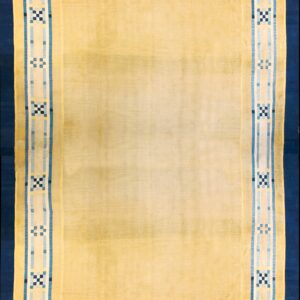 A low-pile pale yellow rug with dark and light blue geometric borders.