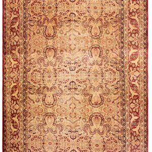 Traditional gold and deep red rug featuring a detailed repeating pattern and contrasting wide borders.