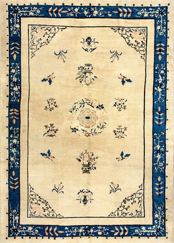 Ivory rug with scattered floral and vessel motifs and a wide, detailed navy blue border.