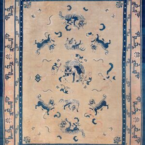 Beige field rug with dark blue stylized animals and a multi-layered border featuring geometric patterns.