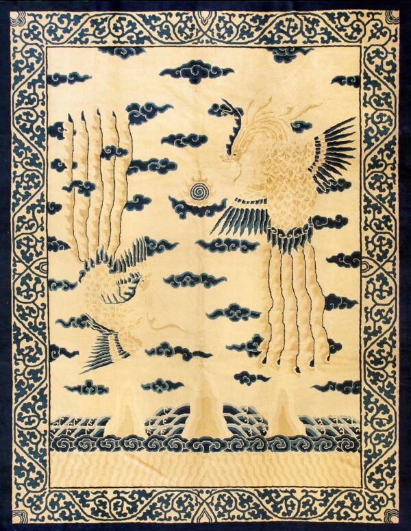 Cream rug with two stylized birds, navy clouds, and waves, surrounded by an ornate scrolling border.