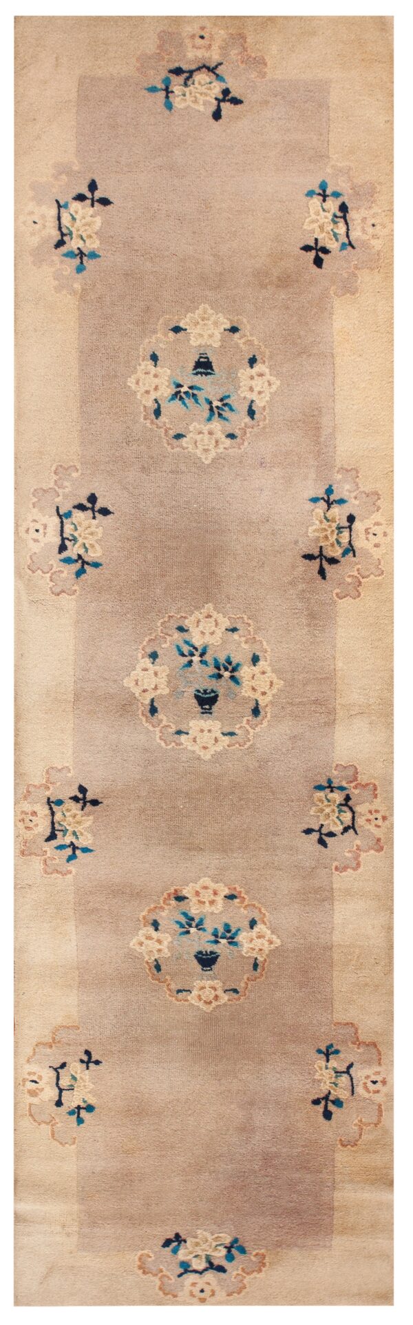 Narrow runner rug featuring a mauve field and beige border with repeating blue and cream floral medallion motifs.