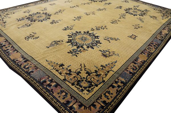 A low-pile yellow rug featuring scattered blue floral designs and detailed geometric-style borders.