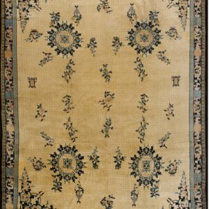 Traditional tan rug with a tonal lattice background and stylized blue, teal, and pink Chinese motifs.