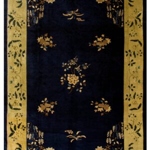 Plush navy rug featuring scattered gold flowers and an elaborate moss green and yellow border.