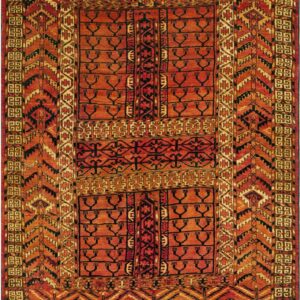 Red and orange rug with dense geometric patterns and stylized black symbols throughout the central field.