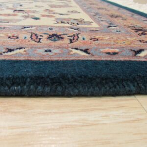 Cream and peach floral rug with a thick teal border lies on a light wood floor.