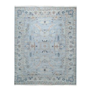 Traditional light blue rug featuring an ornate central medallion and detailed border in cream, tan, and navy.