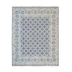 Blue and beige flatweave rug featuring a dense repeating lattice pattern bordered by geometric motifs.