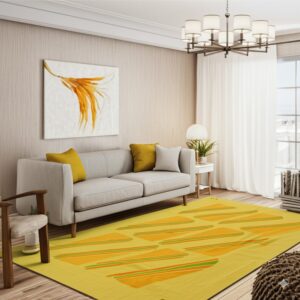 Bright yellow rug featuring repeating orange and green striped geometric shapes on a wood plank floor.