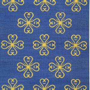 Blue flatweave rug displaying repeating yellow stylized four-leaf clover patterns across the surface.