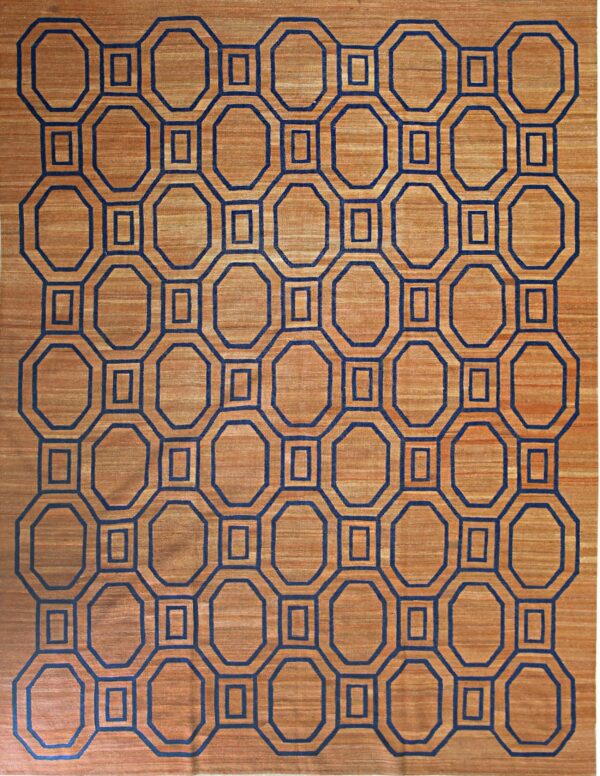Brown striated rug with a bold navy blue repeating geometric interlocking octagon design.