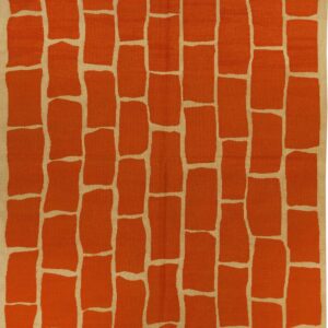 Flatweave rug featuring an irregular terracotta brick pattern on a light tan background.