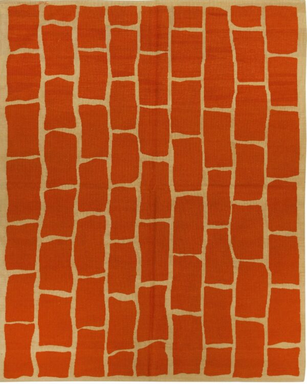 Flatweave rug featuring an irregular terracotta brick pattern on a light tan background.