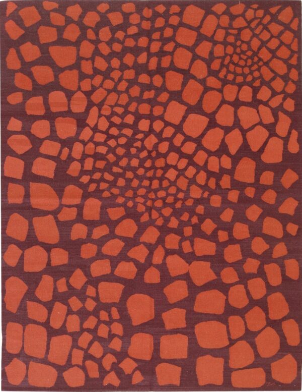 Abstract low-pile rug with rust-colored organic shapes converging toward the center on a deep maroon background.