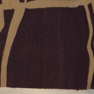 Close-up of a flatweave rug with abstract burgundy and tan stripes on light wood flooring.