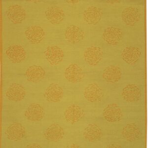 Muted green-yellow rug displaying a grid pattern of orange abstract floral medallions and a matching thin border.