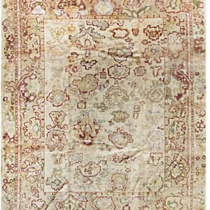 Beige and cream distressed rug featuring an abstract medallion pattern in muted red and olive tones.