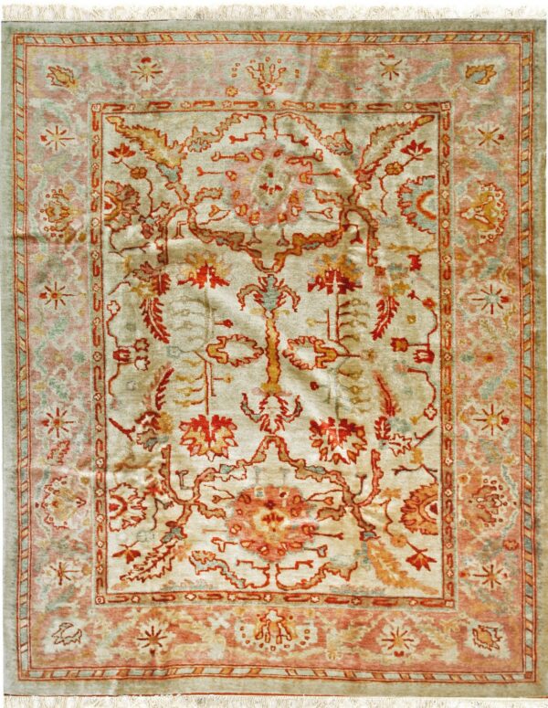 A rectangular rug featuring an intricate red, gold, and pink floral pattern on a pale green background.