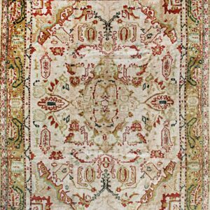 Traditional rug with a pale cream field, detailed red, green, and golden ornate patterns, and fringes.