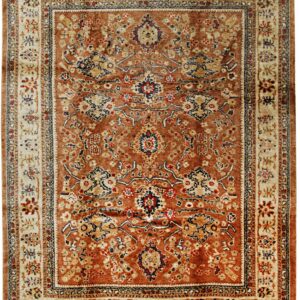 Traditional rug with a rust central field, cream borders, and intricate botanical medallion design.