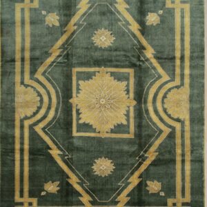 Dark green rug with a symmetrical gold geometric border and a large central diamond floral motif.