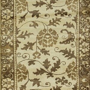 Low-pile runner featuring a cream background with brown floral vines and leaves inside dark, multi-layered borders.