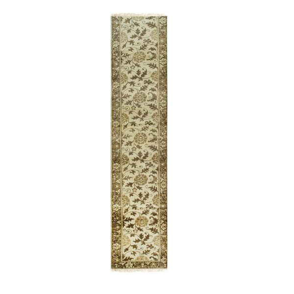 Monochromatic runner rug displaying a detailed brown botanical pattern on a light beige field.