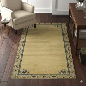 Yellowish-beige rug with a detailed navy blue border rests on dark wood flooring near a beige armchair.
