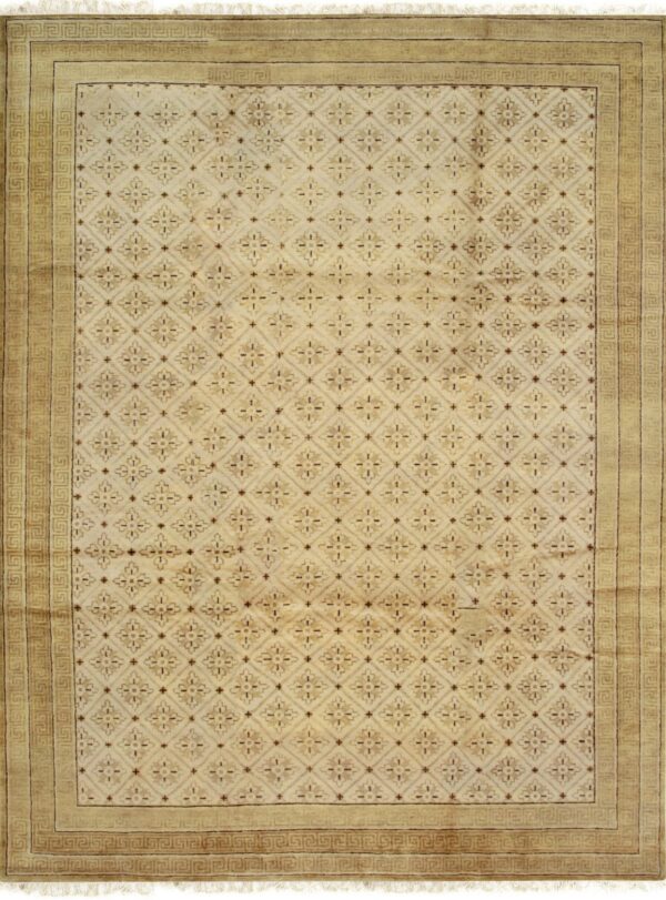 Beige rug featuring a repeating diamond lattice and floral pattern with a wide greek key border.