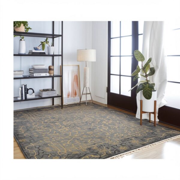 A dark gray rug featuring a distressed golden yellow pattern lays on a hardwood floor.