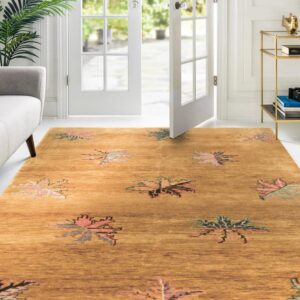 Ochre low pile rug with stylized pink and green leaf pattern near a gray sofa and open white doors.