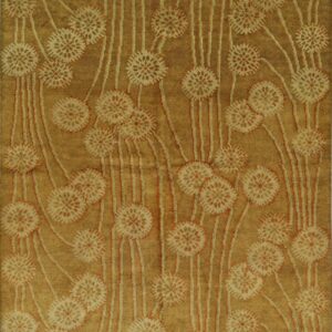 Gold and tan rug with a carved botanical pattern of repeating starburst flowers and vertical stems.