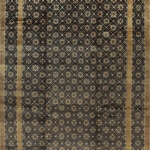 Dark brown rug with an all-over tan diamond lattice and floral medallion design, bordered by solid tan.