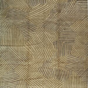 A light tan rug features an abstract geometric pattern of intersecting, irregular stripes in dark brown and olive.