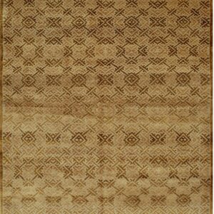 Tan and brown low pile rug featuring a dense, repeating trellis pattern with short white fringes visible.