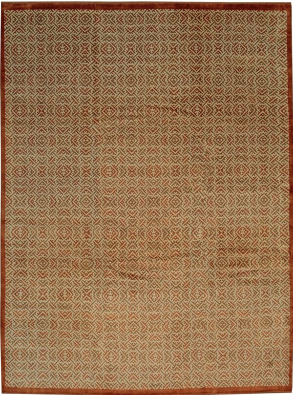 Low pile rug with an all-over repeating geometric pattern in rust orange and cream colors.