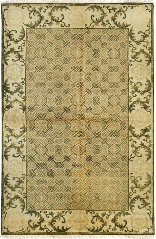 Beige rug with a geometric lattice pattern field and a wide border featuring dark scrolling foliage.