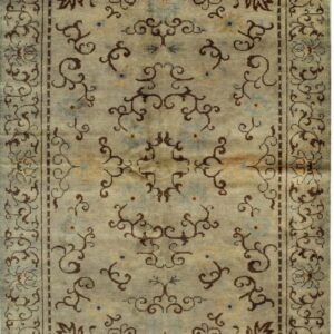 Sage green rug with dark brown scrolling vines and blue floral accents, bordered on all sides.