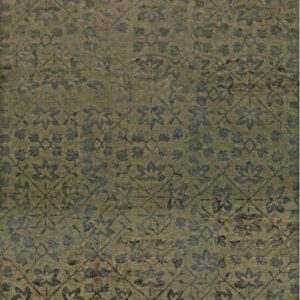 A distressed olive green rug featuring a faded charcoal trellis and stylized floral medallion pattern.