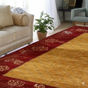 Gold and red rug with geometric field and floral border anchors a living space with a beige sofa.